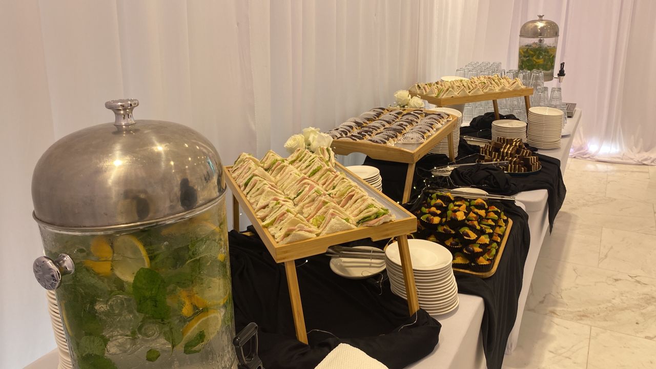 Twenty9 sandwich and finger food display with tiered serving stands